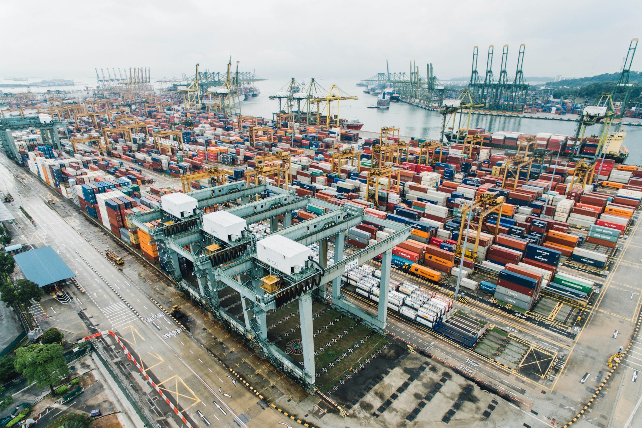 Container terminal with cargo vessels and port cranes